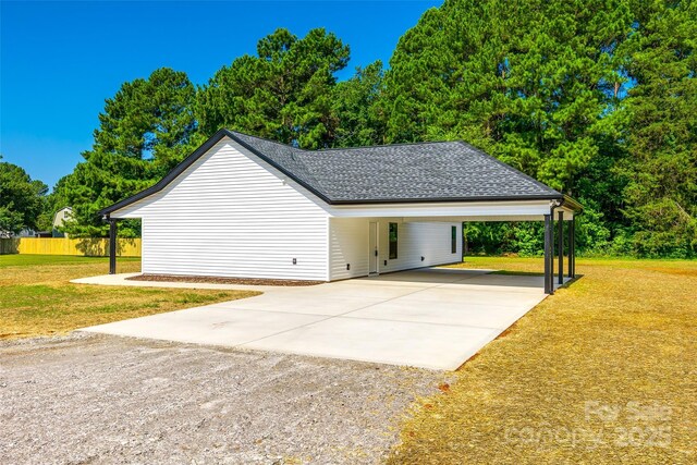 3248 Ferguson Long Rd, York, SC 29745 - view of property exterior with driveway, an attached carport, and roof with shingles