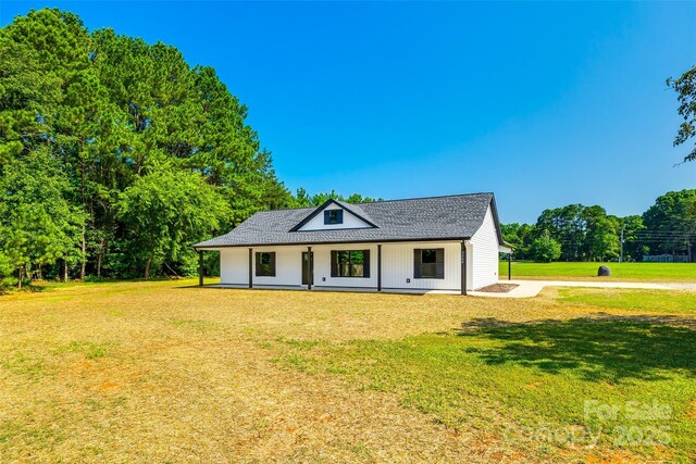 3248 Ferguson Long Rd, York, SC 29745 - modern inspired farmhouse with a porch, a front yard, and roof with shingles