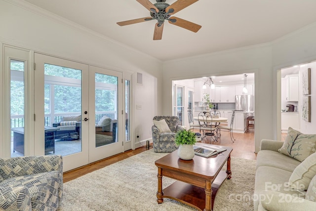 5051 Carillon Way, Charlotte, NC 28270 - living room featuring ornamental molding, light wood-style floors, french doors, and ceiling fan