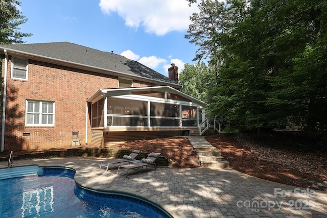 5051 Carillon Way, Charlotte, NC 28270 - back of house featuring a sunroom, a patio area, an outdoor pool, brick siding, and crawl space