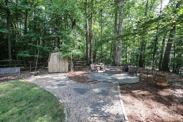 5051 Carillon Way, Charlotte, NC 28270 - view of yard featuring a fire pit, a storage shed, and a patio