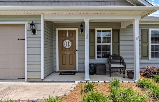 5967 Odenton Ln, Pfafftown, NC 27040 - view of exterior entry with a porch