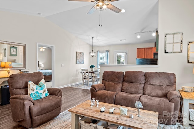 5967 Odenton Ln, Pfafftown, NC 27040 - living room featuring wood finished floors, a ceiling fan, and vaulted ceiling