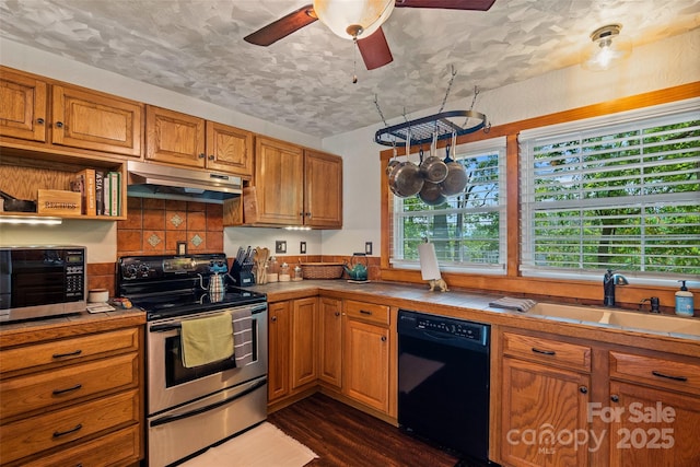 477 Panther Branch Rd, Alexander, NC 28701 - kitchen featuring electric range, dishwasher, under cabinet range hood, dark wood-style flooring, and tile countertops