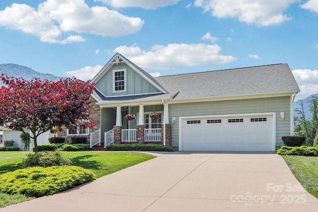 8 Amos Ct, Maggie Valley, NC 28751 - craftsman inspired home featuring driveway, a garage, a porch, a front yard, and board and batten siding