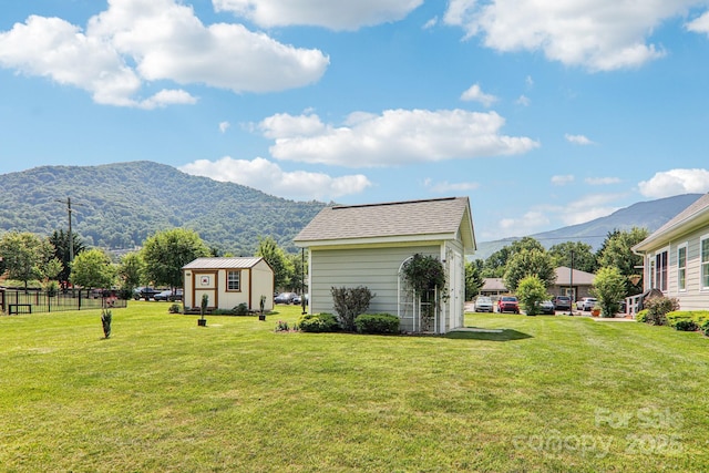 8 Amos Ct, Maggie Valley, NC 28751 - view of grassy yard featuring a mountain view and a storage unit
