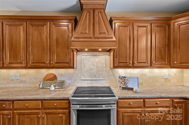 1019 Westlake Dr, Kannapolis, NC 28081 - kitchen featuring electric stove, custom exhaust hood, and brown cabinetry