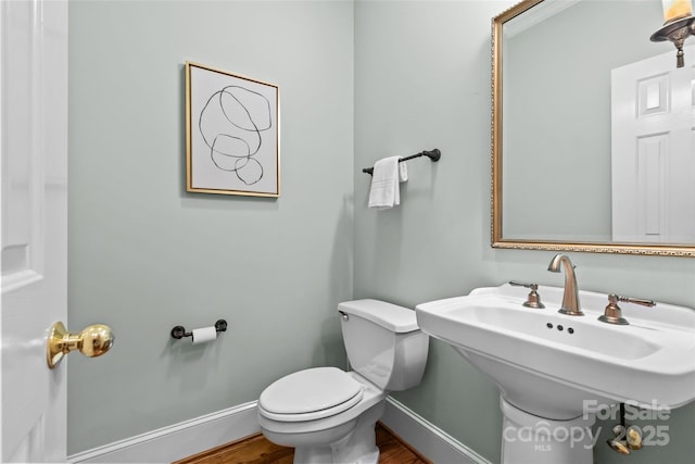 1019 Westlake Dr, Kannapolis, NC 28081 - half bathroom with toilet and wood finished floors