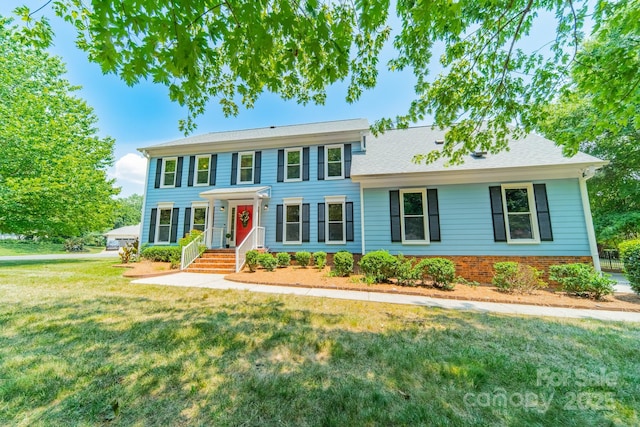 6412 Boykin Spaniel Rd, Charlotte, NC 28277 - colonial home featuring a front yard and brick siding
