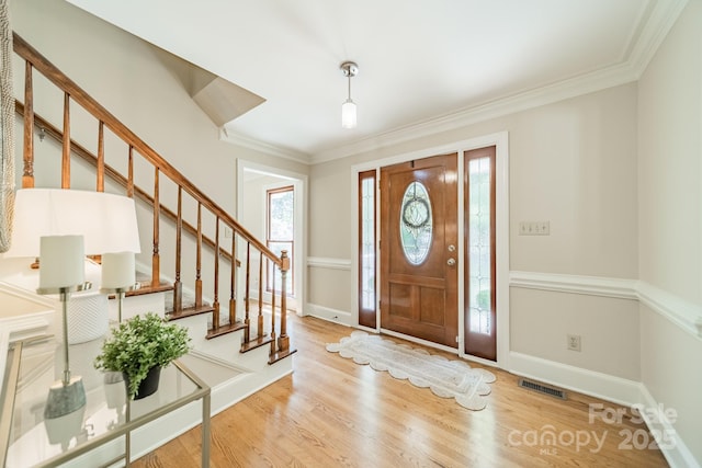 6412 Boykin Spaniel Rd, Charlotte, NC 28277 - foyer with stairs, wood finished floors, and crown molding
