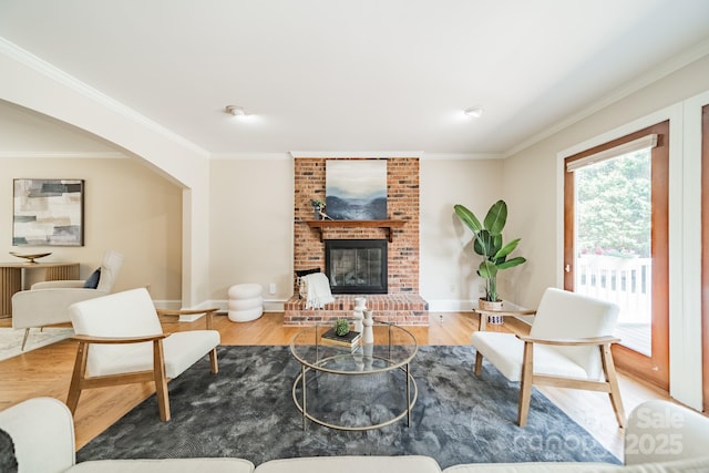 6412 Boykin Spaniel Rd, Charlotte, NC 28277 - living area with crown molding, a fireplace, and wood finished floors