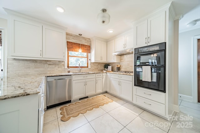 6412 Boykin Spaniel Rd, Charlotte, NC 28277 - kitchen with appliances with stainless steel finishes, backsplash, under cabinet range hood, light tile patterned flooring, and white cabinetry