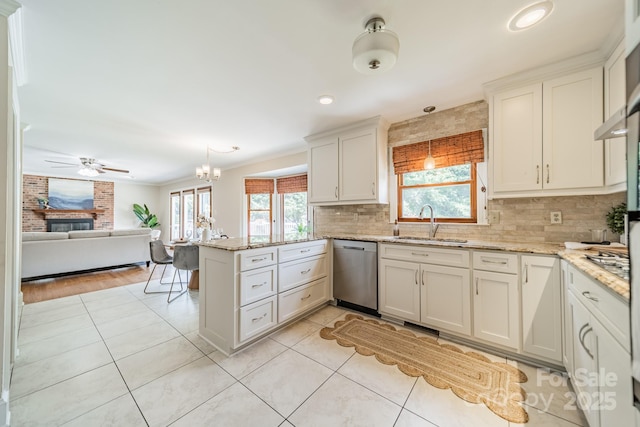 6412 Boykin Spaniel Rd, Charlotte, NC 28277 - kitchen with stainless steel dishwasher, a peninsula, plenty of natural light, light tile patterned floors, and recessed lighting