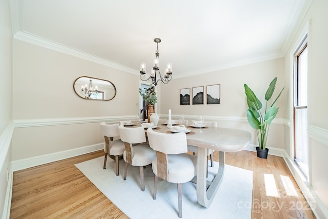 6412 Boykin Spaniel Rd, Charlotte, NC 28277 - dining space with a chandelier, wood finished floors, and ornamental molding