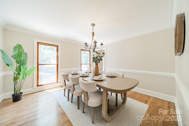 6412 Boykin Spaniel Rd, Charlotte, NC 28277 - dining area with a chandelier, light wood-type flooring, and ornamental molding