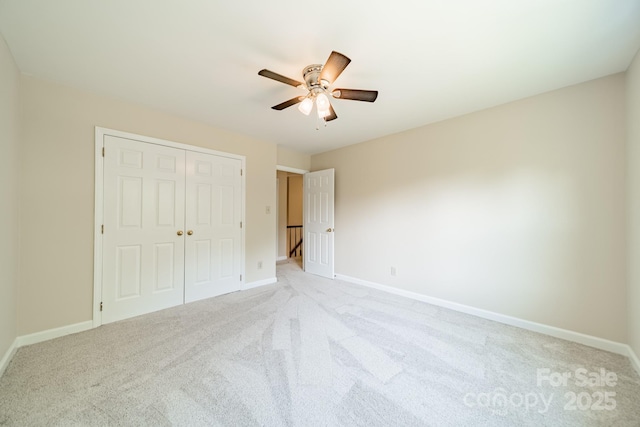 6412 Boykin Spaniel Rd, Charlotte, NC 28277 - unfurnished bedroom featuring light colored carpet, a closet, and a ceiling fan
