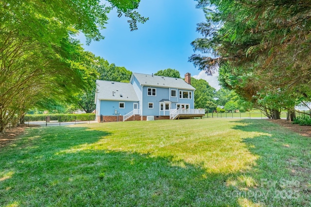 6412 Boykin Spaniel Rd, Charlotte, NC 28277 - rear view of property with a chimney, a fenced backyard, and a wooden deck