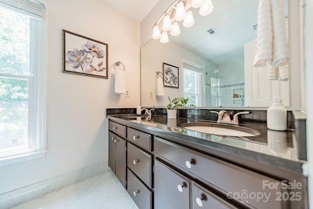 6412 Boykin Spaniel Rd, Charlotte, NC 28277 - bathroom featuring double vanity, tile patterned floors, and a shower stall