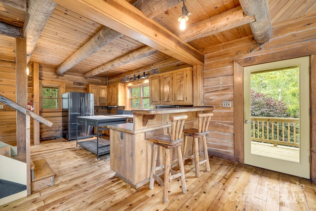 465 Youngs Gap Rd, Fletcher, NC 28732 - kitchen with freestanding refrigerator, a wood ceiling with exposed beams, light wood finished floors, healthy amount of natural light, and a kitchen breakfast bar
