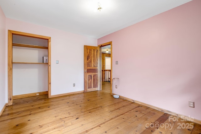 465 Youngs Gap Rd, Fletcher, NC 28732 - unfurnished bedroom featuring hardwood / wood-style floors