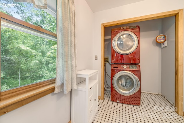 465 Youngs Gap Rd, Fletcher, NC 28732 - laundry room featuring stacked washing machine and dryer and healthy amount of natural light