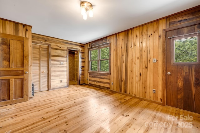 465 Youngs Gap Rd, Fletcher, NC 28732 - unfurnished bedroom with wood walls and hardwood / wood-style floors