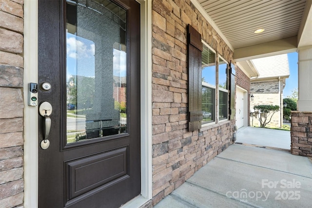 2377 Maple Grove Ln NW, Concord, NC 28027 - property entrance featuring a porch and brick siding