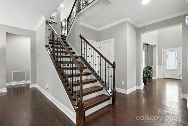 2377 Maple Grove Ln NW, Concord, NC 28027 - stairway featuring crown molding and wood finished floors