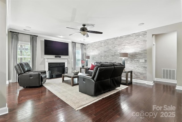 2377 Maple Grove Ln NW, Concord, NC 28027 - living room with a ceiling fan, hardwood / wood-style flooring, a fireplace with flush hearth, and crown molding