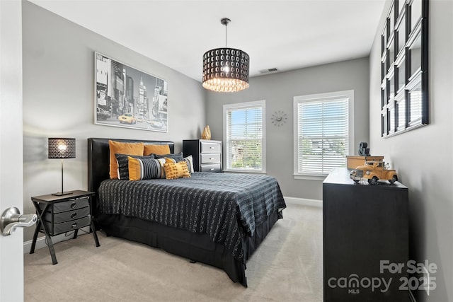 2377 Maple Grove Ln NW, Concord, NC 28027 - carpeted bedroom featuring baseboards and a chandelier
