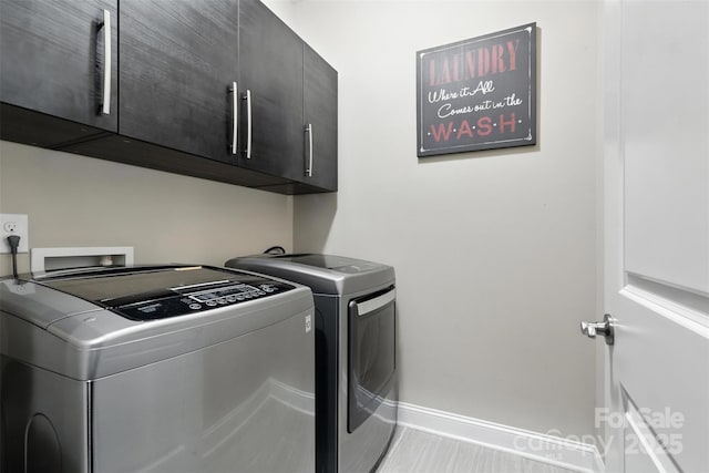 2377 Maple Grove Ln NW, Concord, NC 28027 - laundry room with cabinet space and washer and clothes dryer