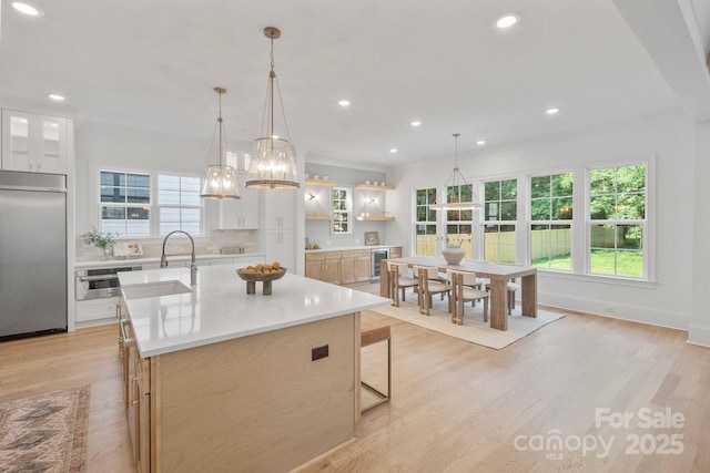 4349 Castleton Rd, Charlotte, NC 28211 - kitchen featuring built in refrigerator, a chandelier, light countertops, an island with sink, and beverage cooler