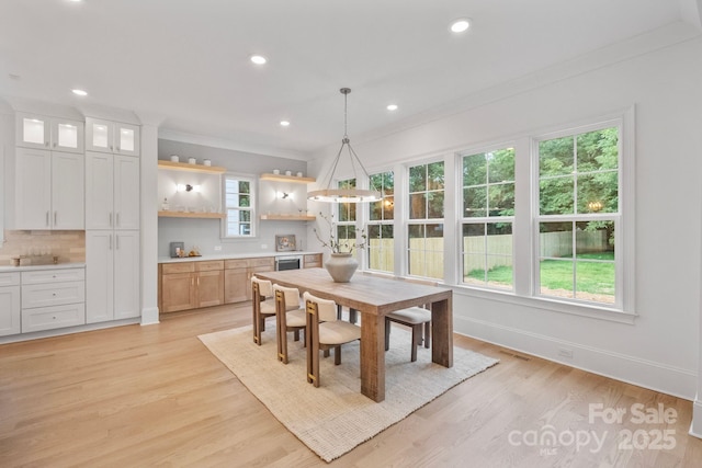 4349 Castleton Rd, Charlotte, NC 28211 - dining space with recessed lighting, light wood-style flooring, crown molding, and beverage cooler
