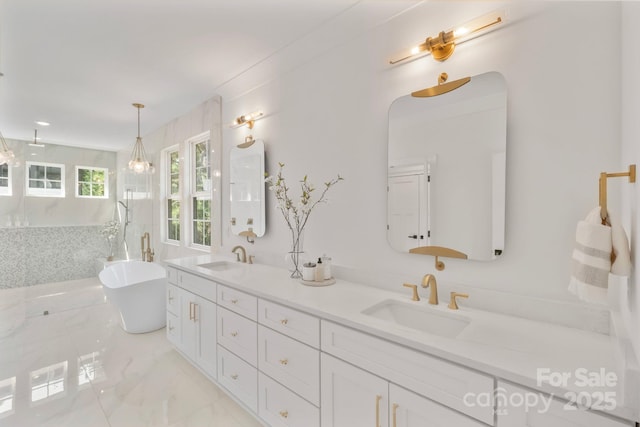 4349 Castleton Rd, Charlotte, NC 28211 - full bath with double vanity, a soaking tub, a marble finish shower, and marble finish floors