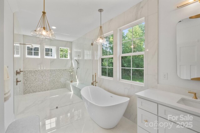 4349 Castleton Rd, Charlotte, NC 28211 - full bathroom with a soaking tub, vanity, a marble finish shower, marble tiled flooring, and a chandelier