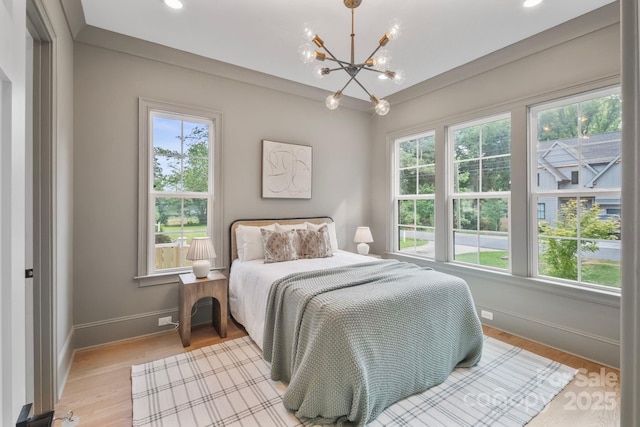 4349 Castleton Rd, Charlotte, NC 28211 - bedroom featuring multiple windows, a chandelier, light wood-type flooring, and recessed lighting