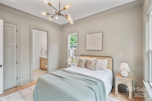 4349 Castleton Rd, Charlotte, NC 28211 - bedroom with a chandelier, light wood-style floors, and ensuite bath