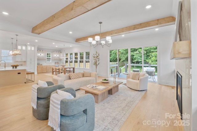 4349 Castleton Rd, Charlotte, NC 28211 - living room with a chandelier, beamed ceiling, light wood-type flooring, healthy amount of natural light, and recessed lighting