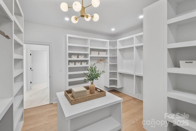 4349 Castleton Rd, Charlotte, NC 28211 - walk in closet featuring a chandelier and light wood finished floors