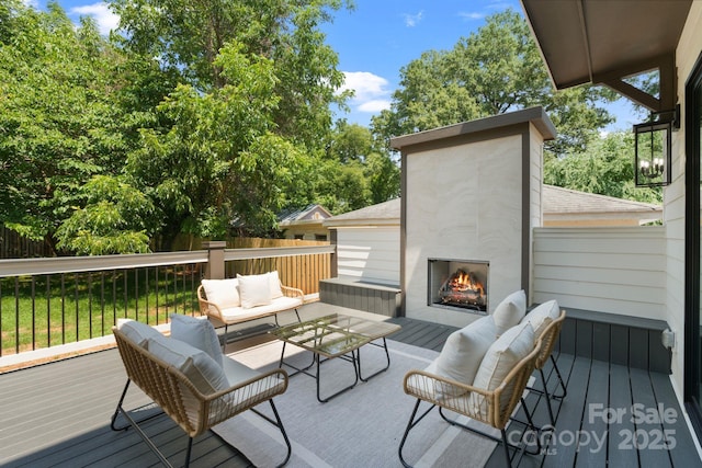 4349 Castleton Rd, Charlotte, NC 28211 - wooden terrace with an outdoor living space with a fireplace