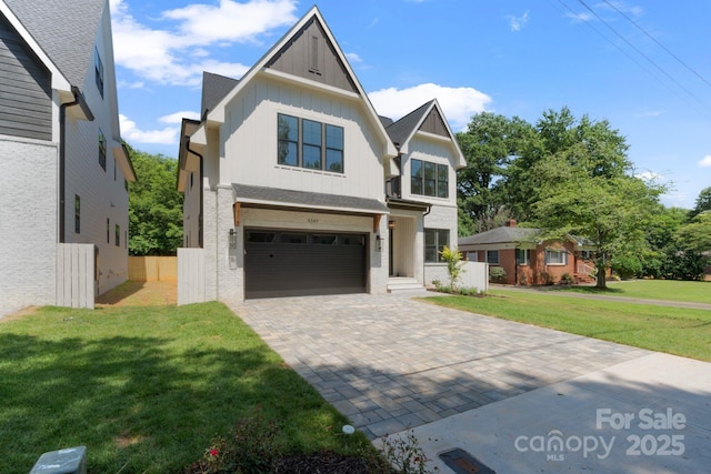 4349 Castleton Rd, Charlotte, NC 28211 - view of front of home featuring board and batten siding, an attached garage, and decorative driveway