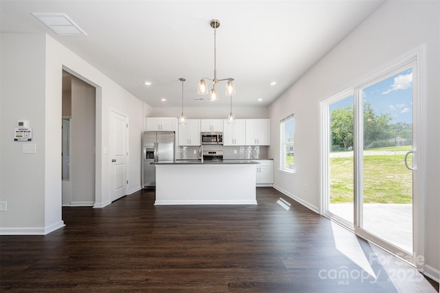1209 Cathey Rd, Charlotte, NC 28214 - kitchen with appliances with stainless steel finishes, dark wood-type flooring, white cabinetry, an island with sink, and recessed lighting