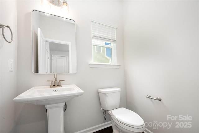 1209 Cathey Rd, Charlotte, NC 28214 - bathroom featuring toilet and baseboards