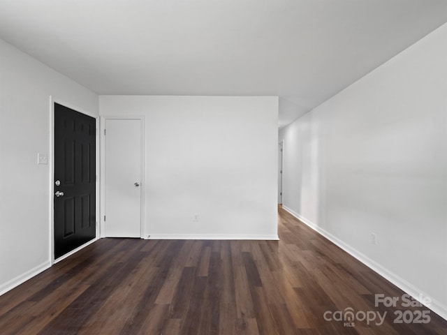 405 Jones St, Monroe, NC 28110 - empty room featuring dark wood-style flooring and baseboards