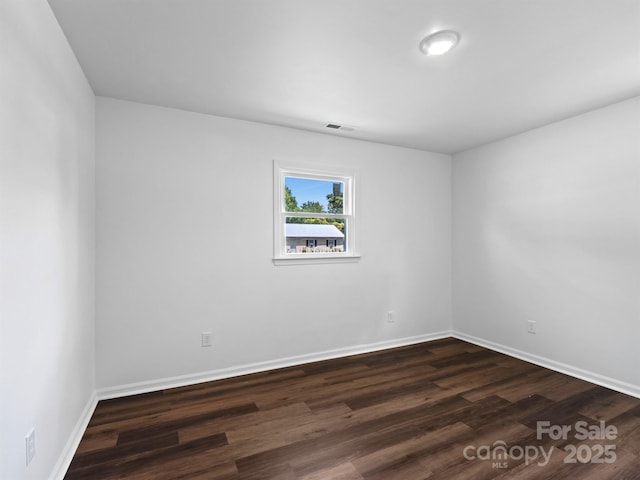 405 Jones St, Monroe, NC 28110 - unfurnished room with dark wood-type flooring and baseboards