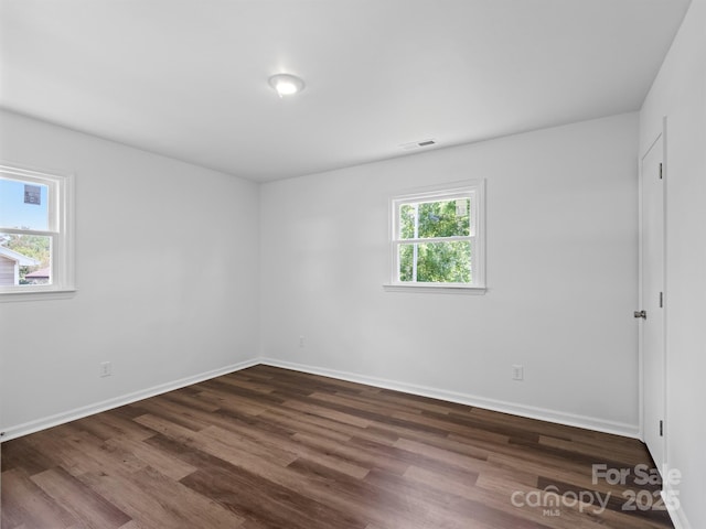 405 Jones St, Monroe, NC 28110 - spare room featuring dark wood finished floors and baseboards