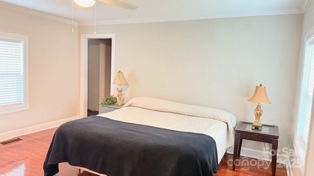 210 W Church St, Cherryville, NC 28021 - bedroom with wood finished floors, crown molding, and ceiling fan