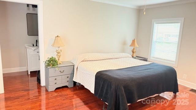 210 W Church St, Cherryville, NC 28021 - bedroom featuring wood finished floors and ornamental molding