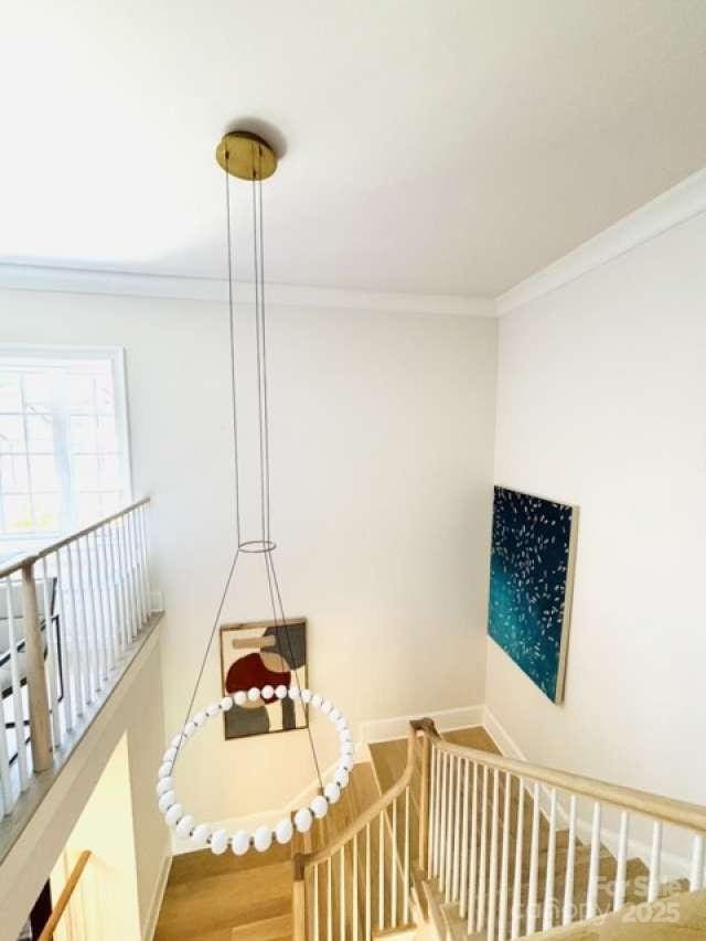 3011 Ella Katherine Way, Charlotte, NC 28210 - staircase with crown molding and wood finished floors