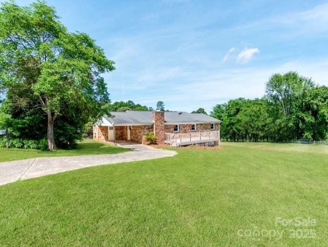 1606 N Rhyne St, Gastonia, NC 28054 - view of front of house with driveway, a front lawn, and a deck
